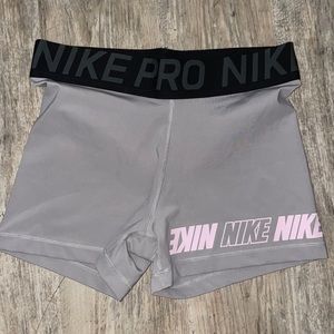 Nike pro spandex shorts. Size Large . Like new. Grey pink and black